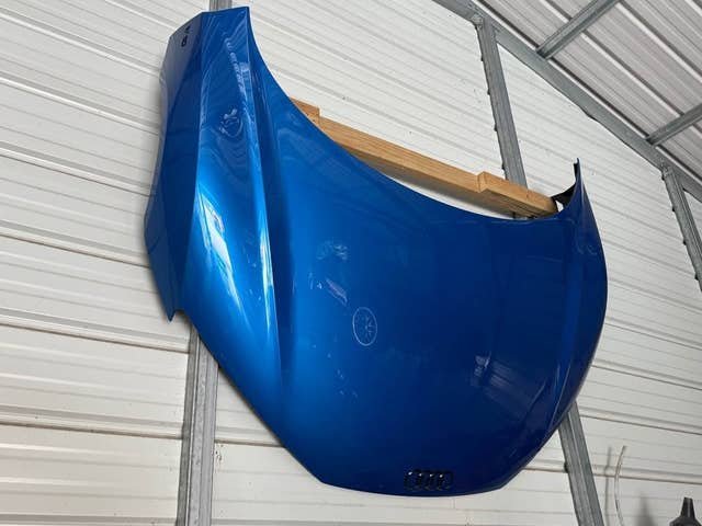Hood OEM Gen 2 Audi R8 V10 Blue Factory Paint w/ Gloss Black Rings & Emblems.
